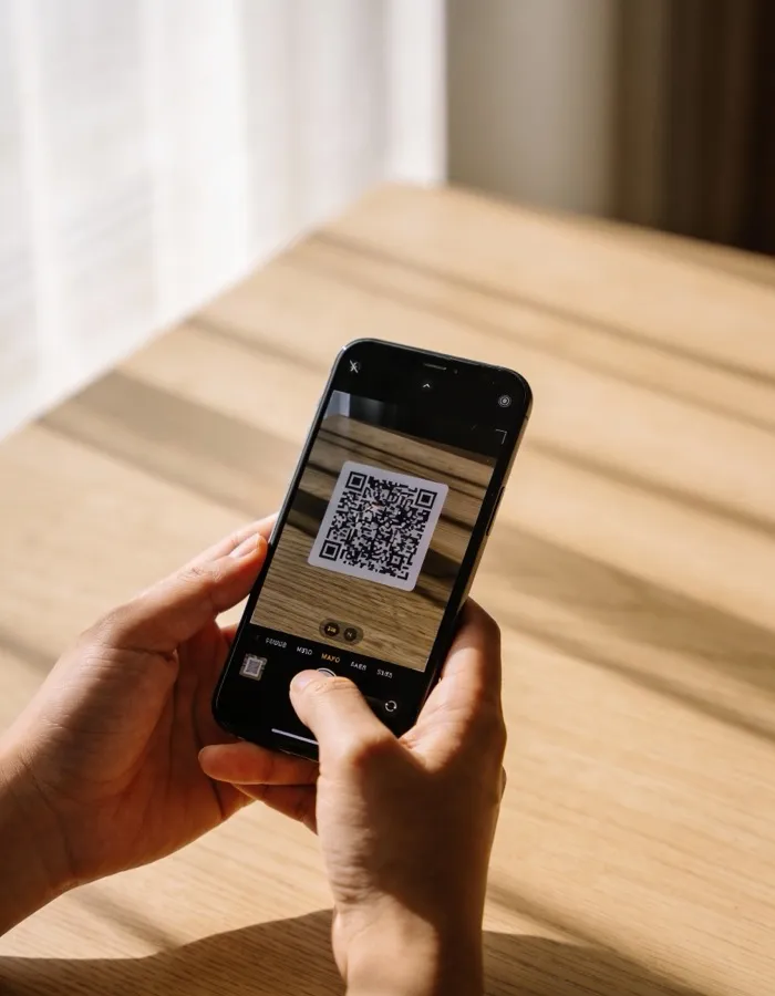 Scanning a QR code with a phone to connect WhatsApp